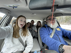 Mr. M in the car with high school STUCO members