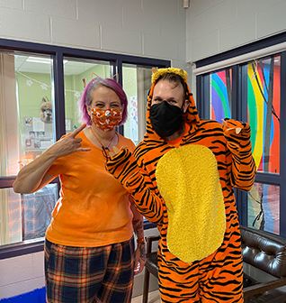 Two happy teachers in costumes