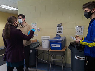Students gathering compost and recycling